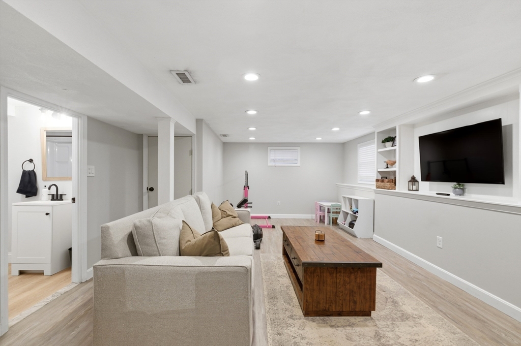 7 Paulette Drive Danvers, MA 01923 - Photo 18 of 25 a living room with furniture and a flat screen tv