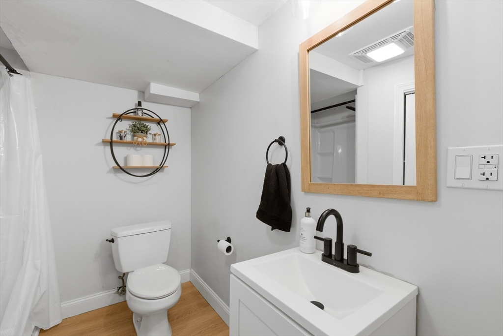 7 Paulette Drive Danvers, MA 01923 - Photo 20 of 25 a bathroom with a toilet sink and mirror