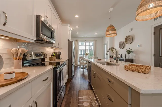 a dining room with furniture and wooden floor