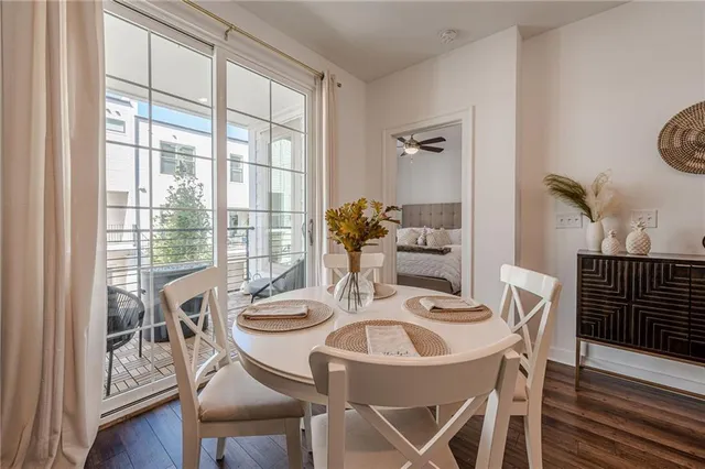 a dining room with furniture and wooden floor