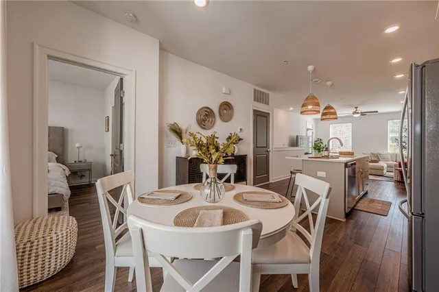 a view of a dining room with furniture and a chandelier