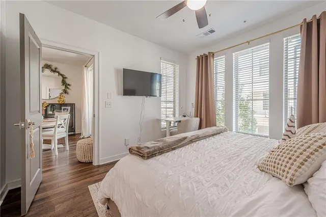 a bathroom with double sink and a mirror