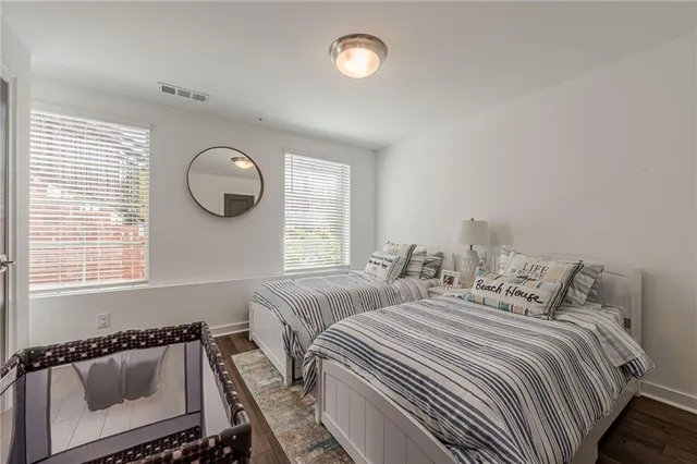 a bedroom with double bed and a couch