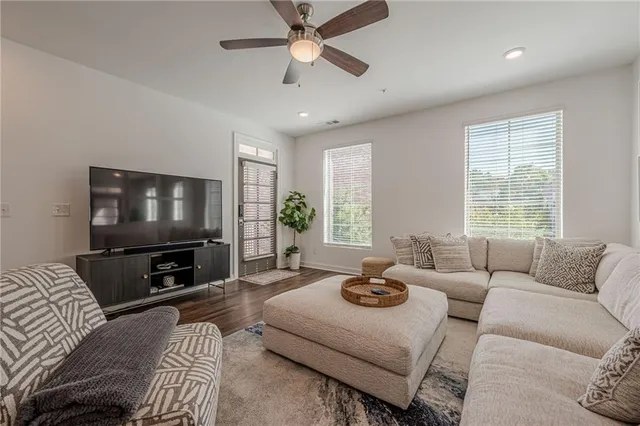 a living room with furniture and a large window