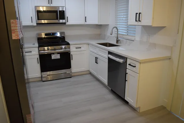 a kitchen with a stove and a microwave