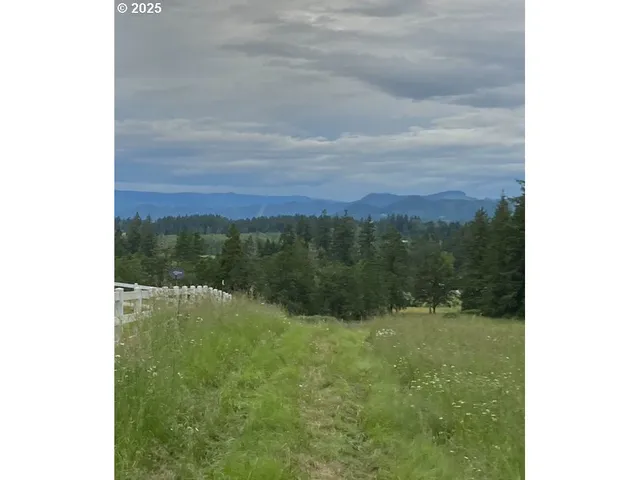 a view of balcony with a yard