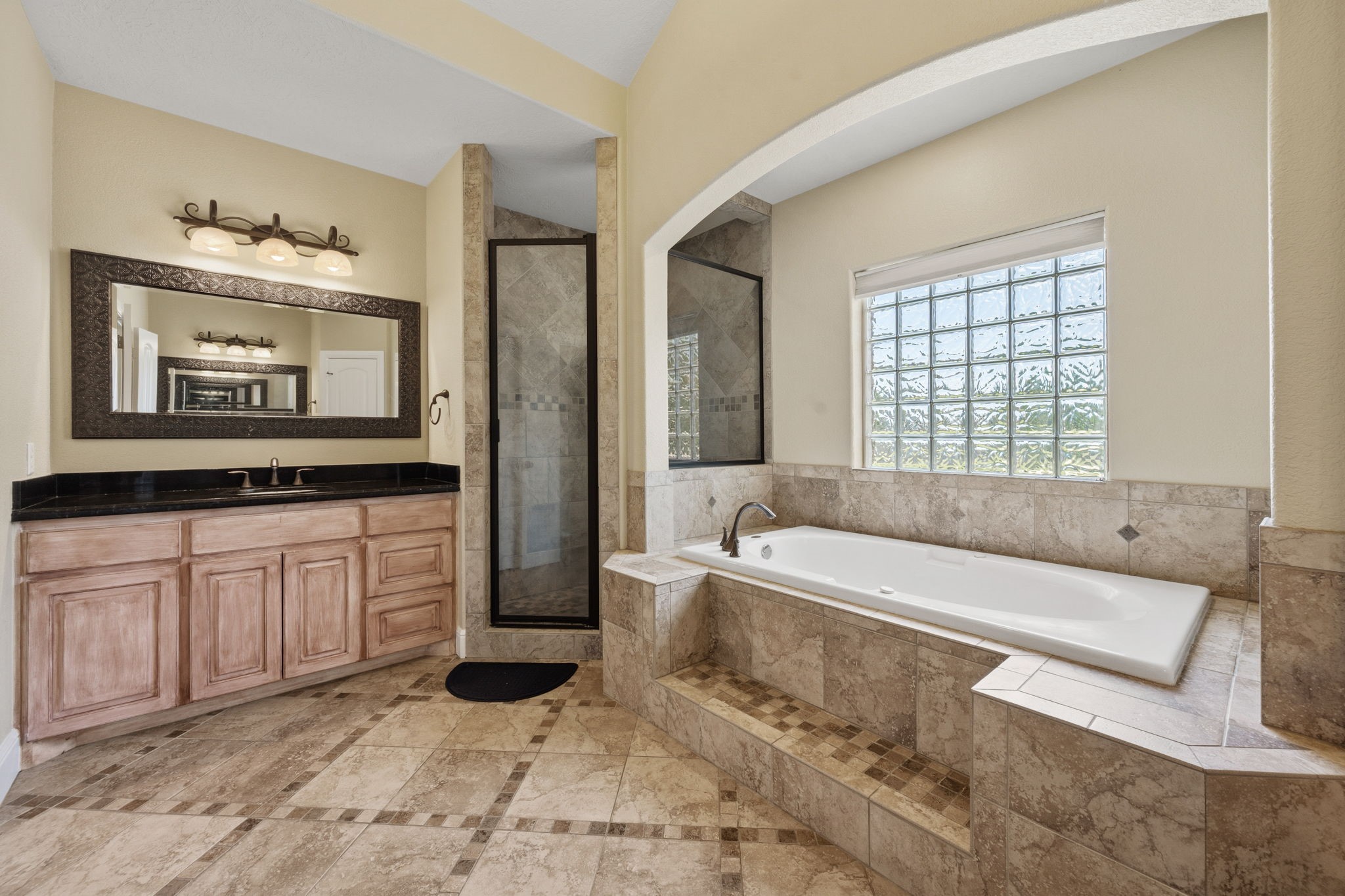 5041 Rimrock Pass Montgomery, TX 77316 - Photo 22 of 44 Primary Bathroom with soaker/jetted tub and separate shower. This also shows 1 of 2 separate vanity areas