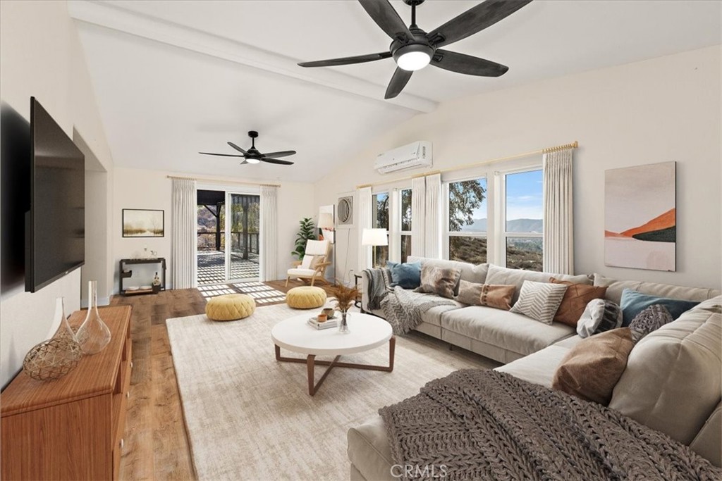 42557 Gibbel Road Hemet, CA 92544 - Photo 15 of 39 a living room with furniture and a flat screen tv