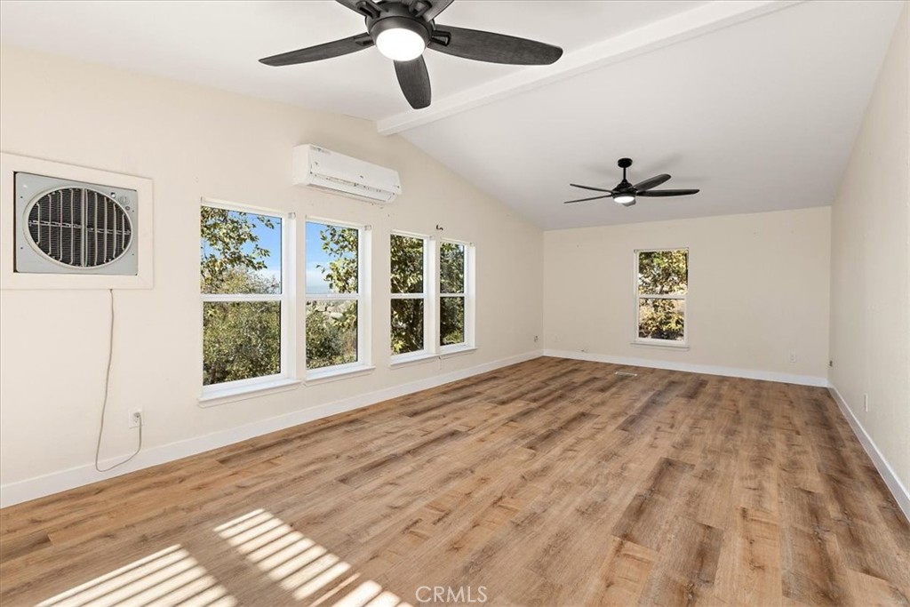 42557 Gibbel Road Hemet, CA 92544 - Photo 16 of 39 a view of an empty room with a window and kitchen view
