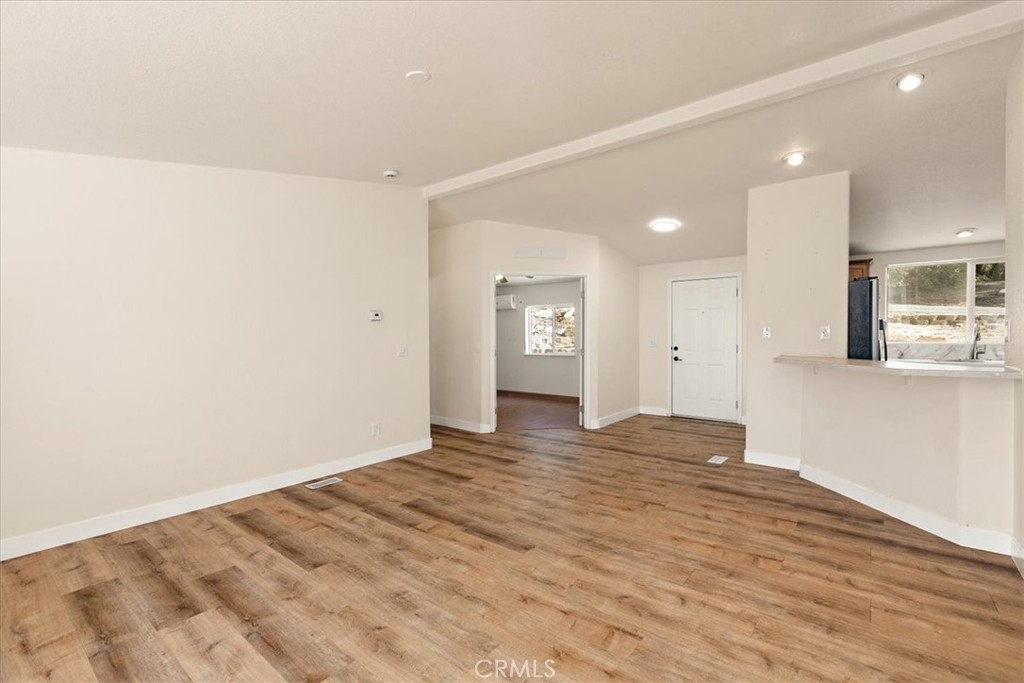 42557 Gibbel Road Hemet, CA 92544 - Photo 18 of 39 a view of an empty room with kitchen and window