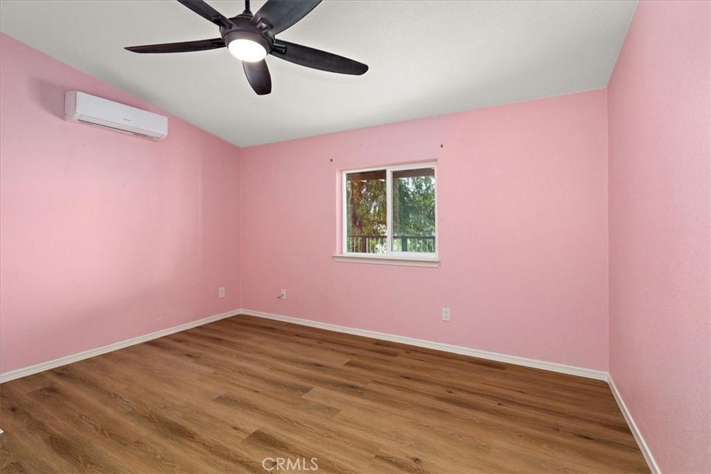 42557 Gibbel Road Hemet, CA 92544 - Photo 19 of 39 a view of a big room with wooden floor and windows