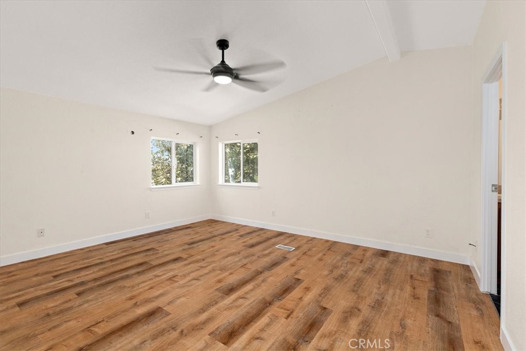 42557 Gibbel Road Hemet, CA 92544 - Photo 27 of 39 a view of empty room with wooden floor and fan