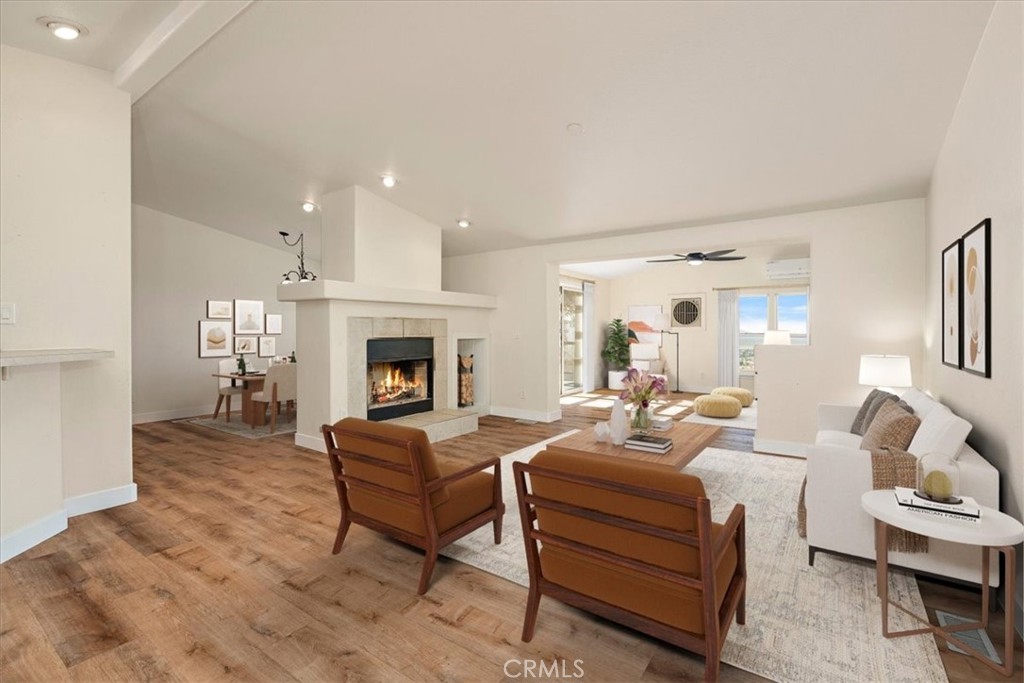 42557 Gibbel Road Hemet, CA 92544 - Photo 3 of 39 a living room with furniture fireplace and a window