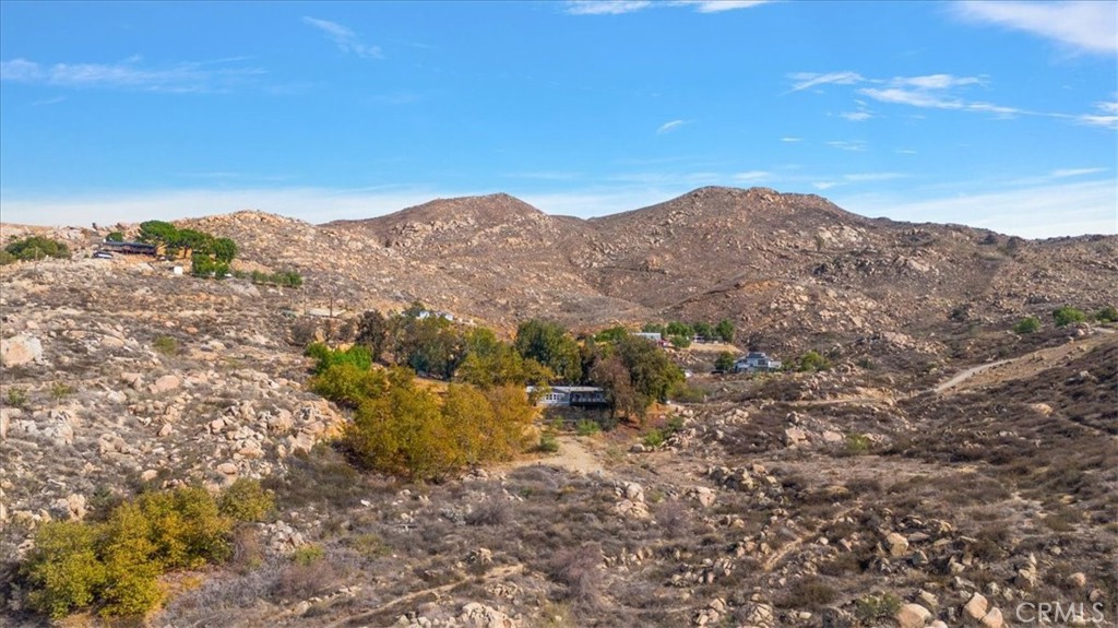 42557 Gibbel Road Hemet, CA 92544 - Photo 39 of 39 a view of a house with a mountain and a forest