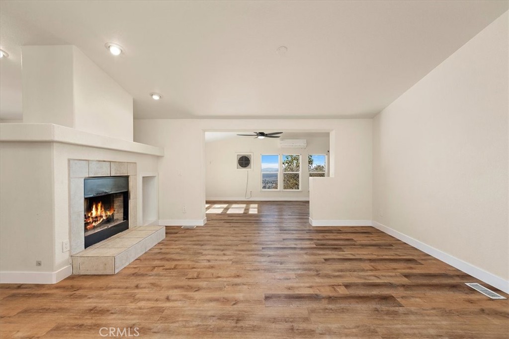 42557 Gibbel Road Hemet, CA 92544 - Photo 4 of 39 a view of empty room with a fireplace