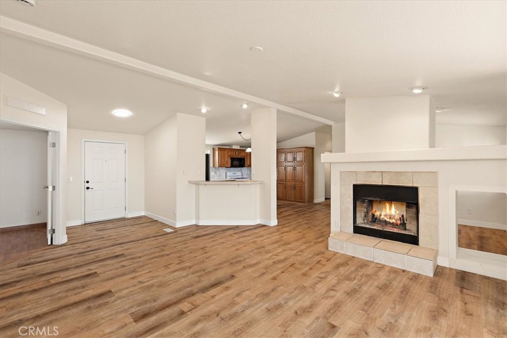 42557 Gibbel Road Hemet, CA 92544 - Photo 5 of 39 a view of a livingroom with wooden floor and a fireplace