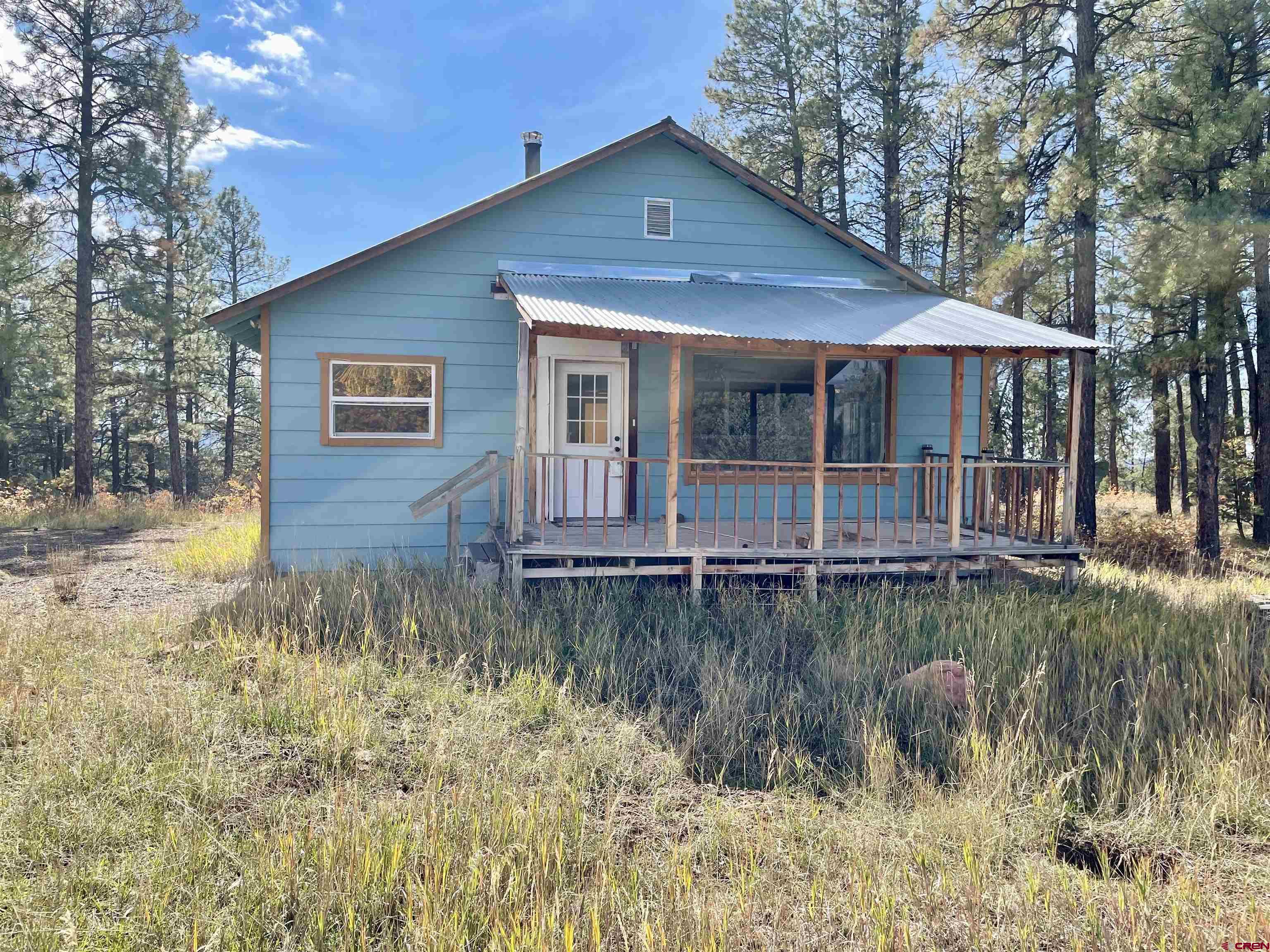 307 Deer Trail Road Durango, CO 81303 - Photo 3 of 16 a front view of a house with a yard