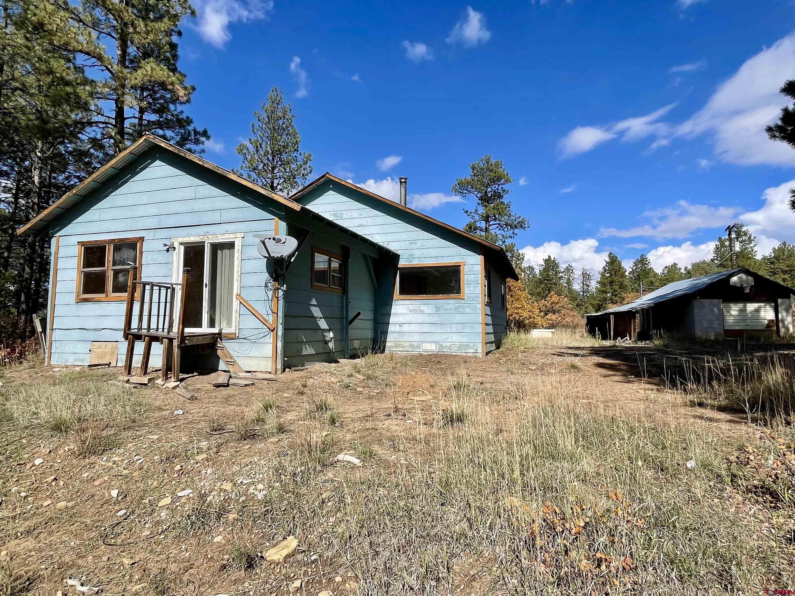 307 Deer Trail Road Durango, CO 81303 - Photo 5 of 16 a view of a house with a patio
