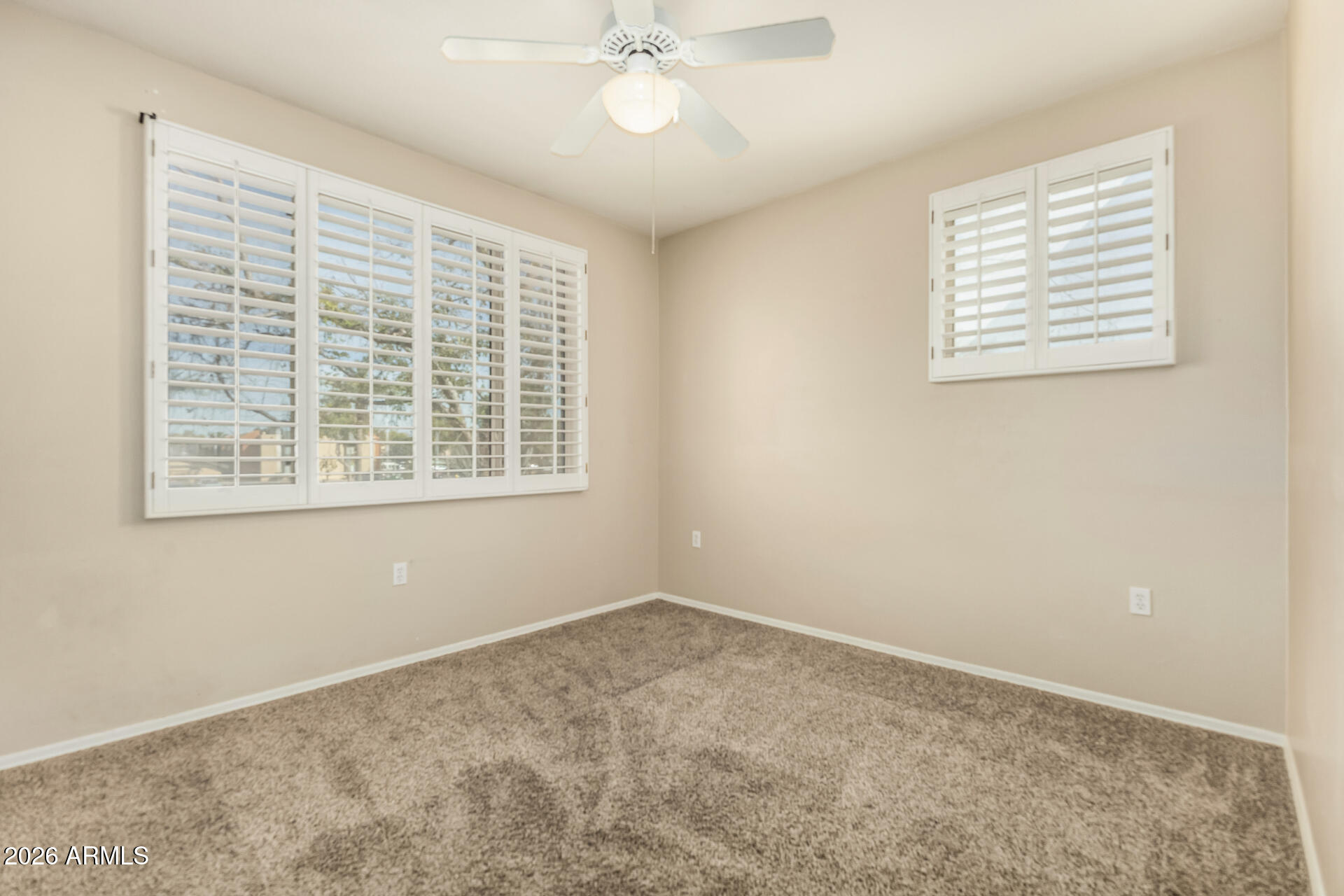 1445 East Broadway Road, Unit 116 Tempe, AZ 85282 - Photo 16 of 36 a view of an empty room with a window