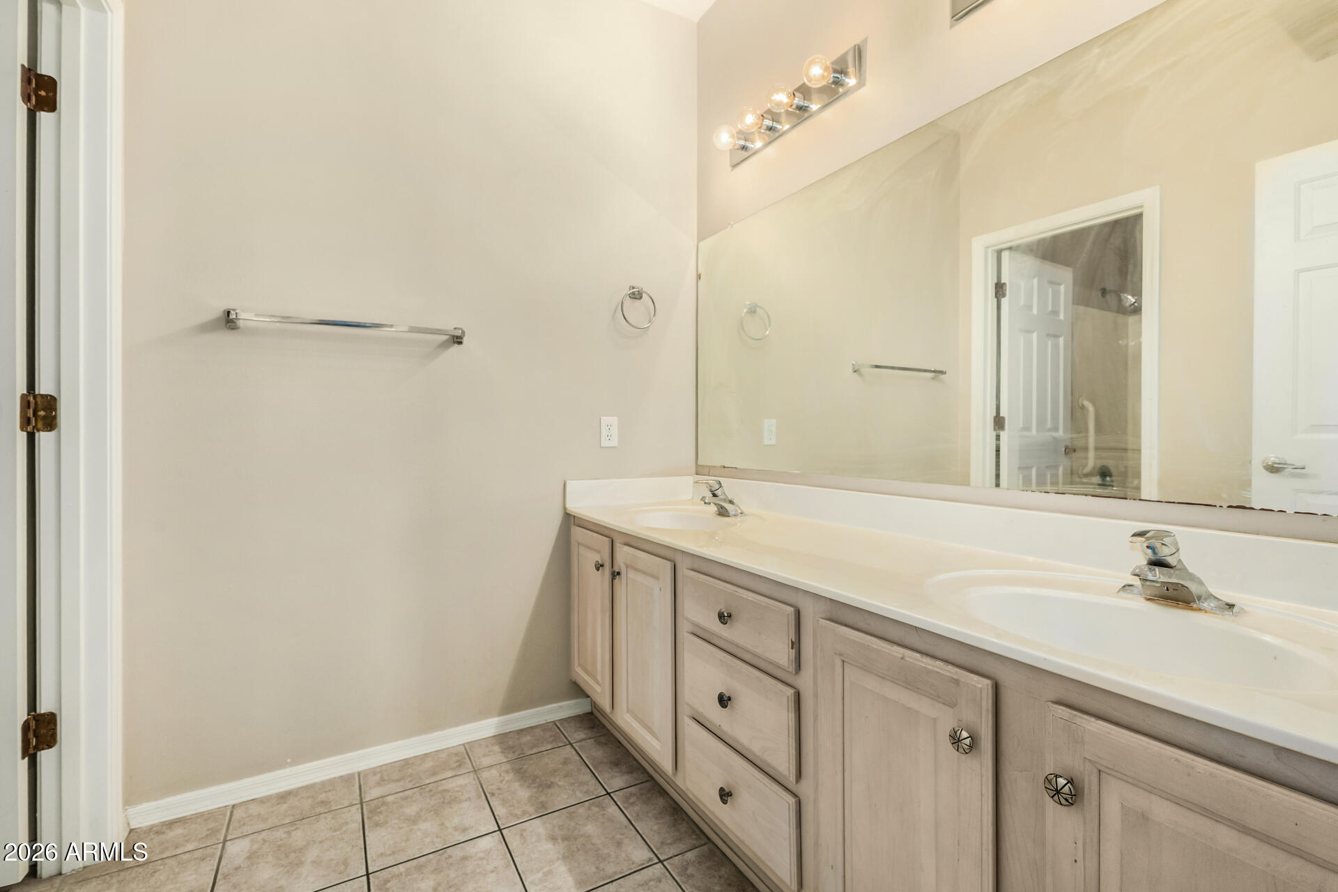 1445 East Broadway Road, Unit 116 Tempe, AZ 85282 - Photo 18 of 36 a spacious bathroom with double sink and mirror
