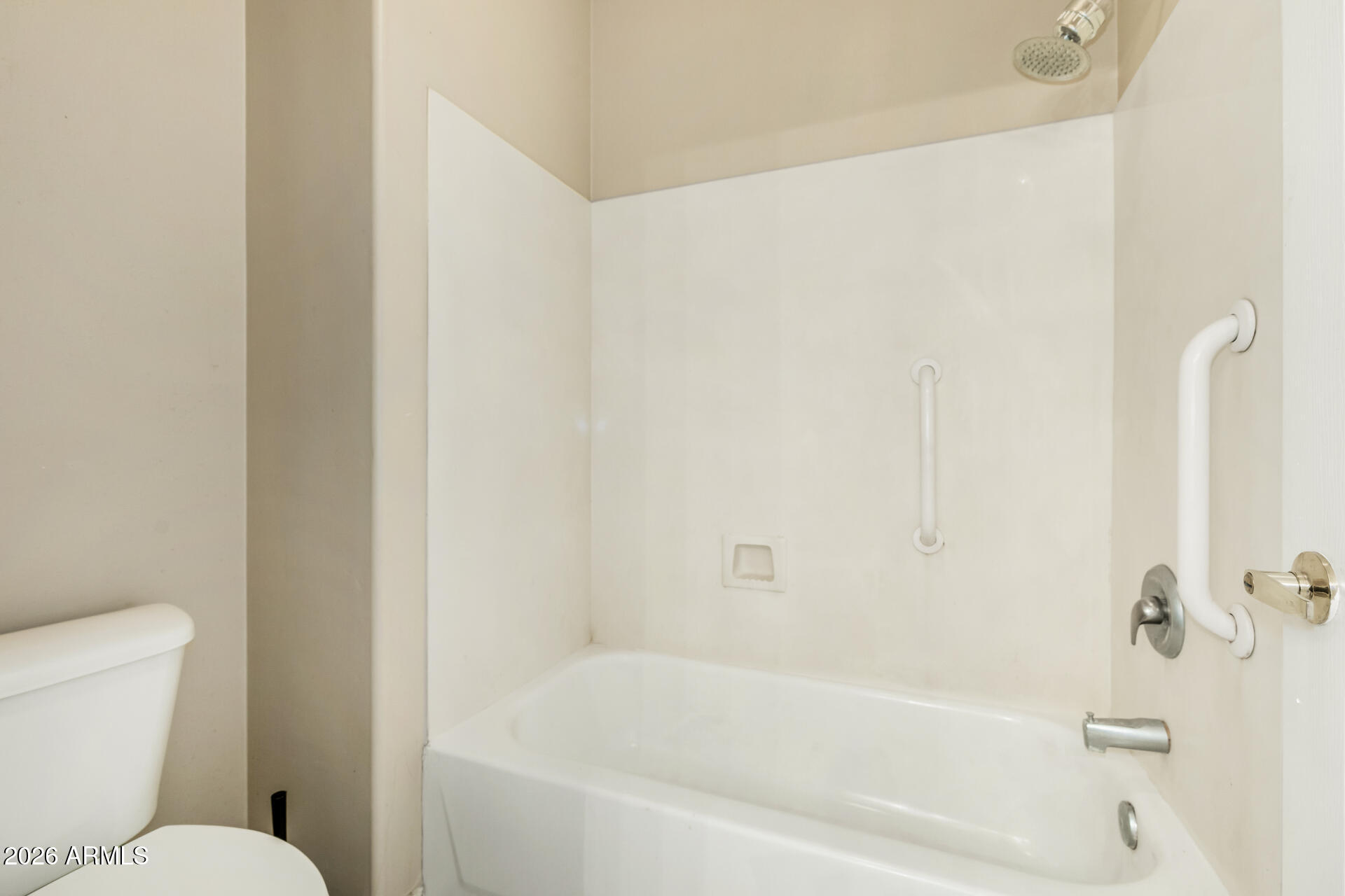 1445 East Broadway Road, Unit 116 Tempe, AZ 85282 - Photo 19 of 36 a white bath tub sitting next to a white toilet