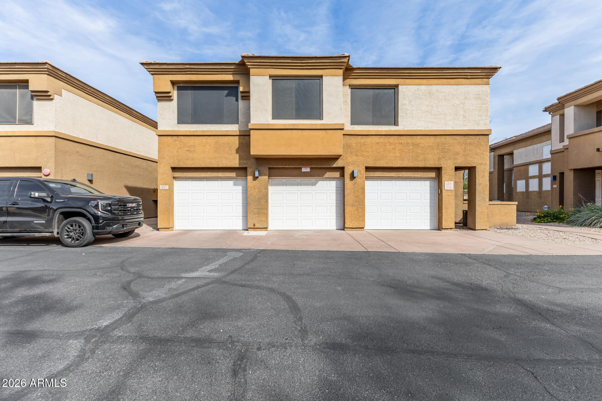 1445 East Broadway Road, Unit 116 Tempe, AZ 85282 - Photo 2 of 36 a car parked in front of a building
