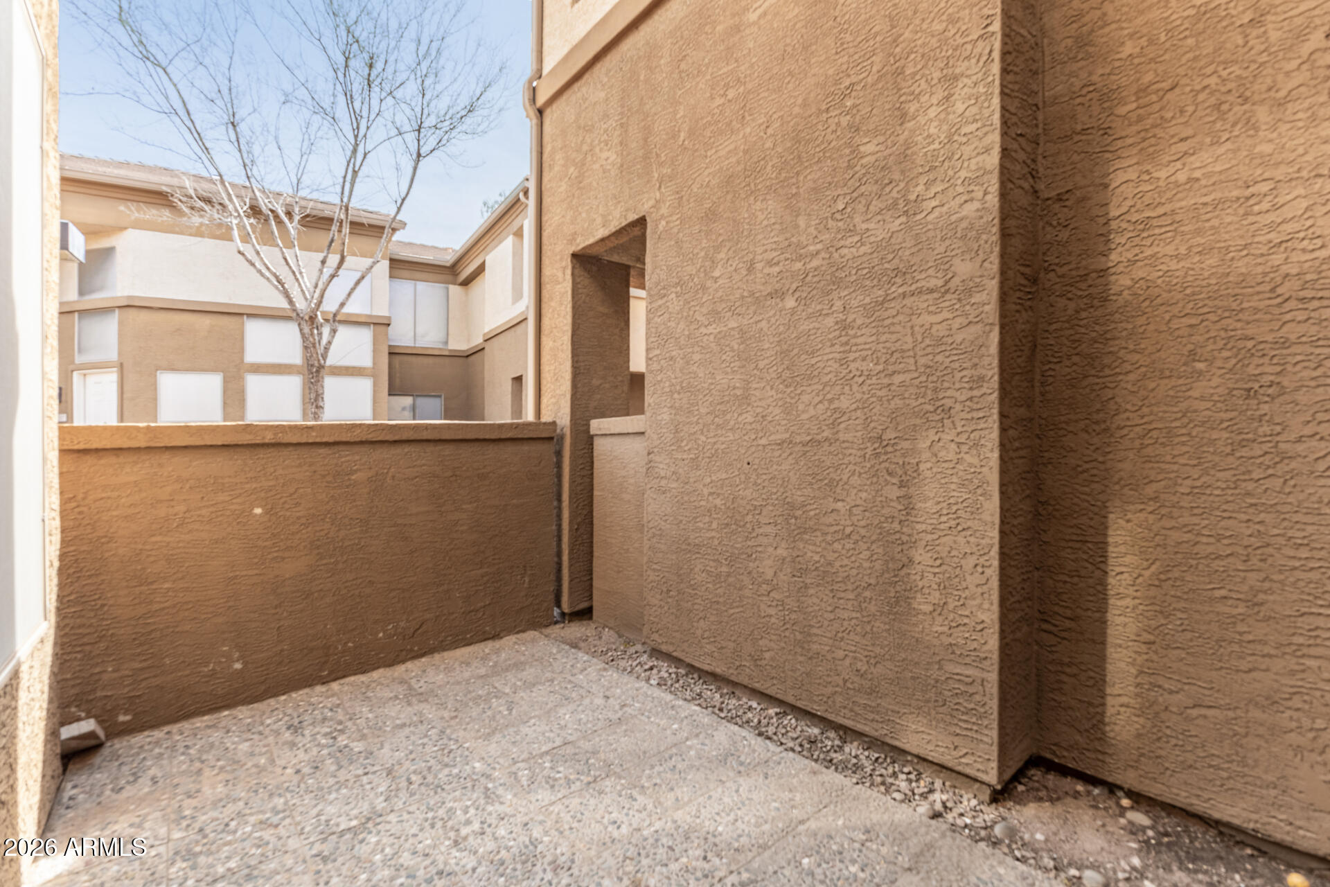1445 East Broadway Road, Unit 116 Tempe, AZ 85282 - Photo 27 of 36 a view of a brick house with a street