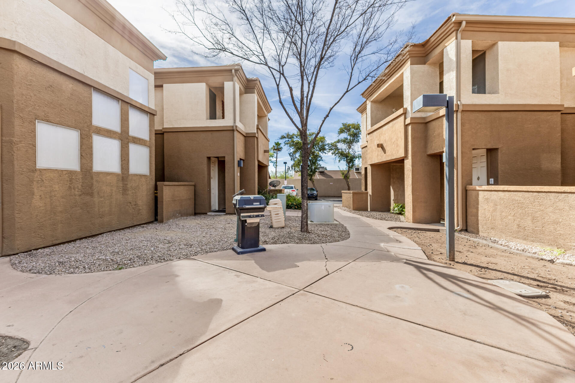 1445 East Broadway Road, Unit 116 Tempe, AZ 85282 - Photo 30 of 36 a view of a house with a patio