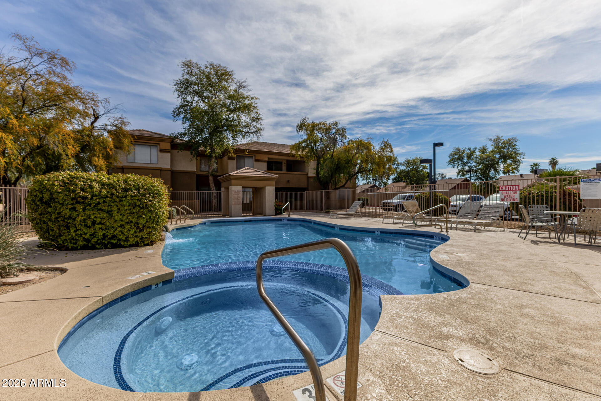 1445 East Broadway Road, Unit 116 Tempe, AZ 85282 - Photo 33 of 36 a view of a swimming pool with outdoor seating