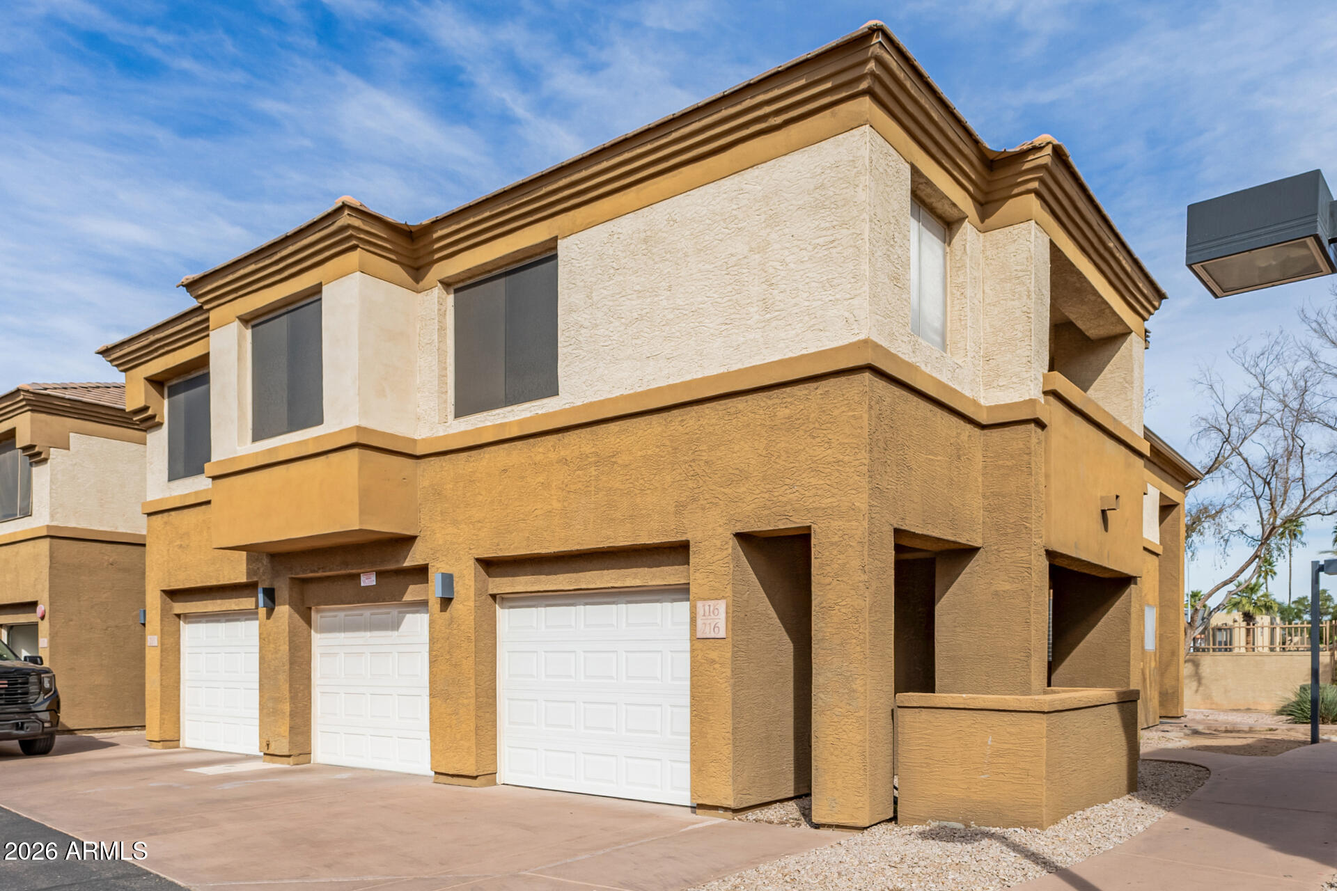 1445 East Broadway Road, Unit 116 Tempe, AZ 85282 - Photo 5 of 36 a view of a building with a street