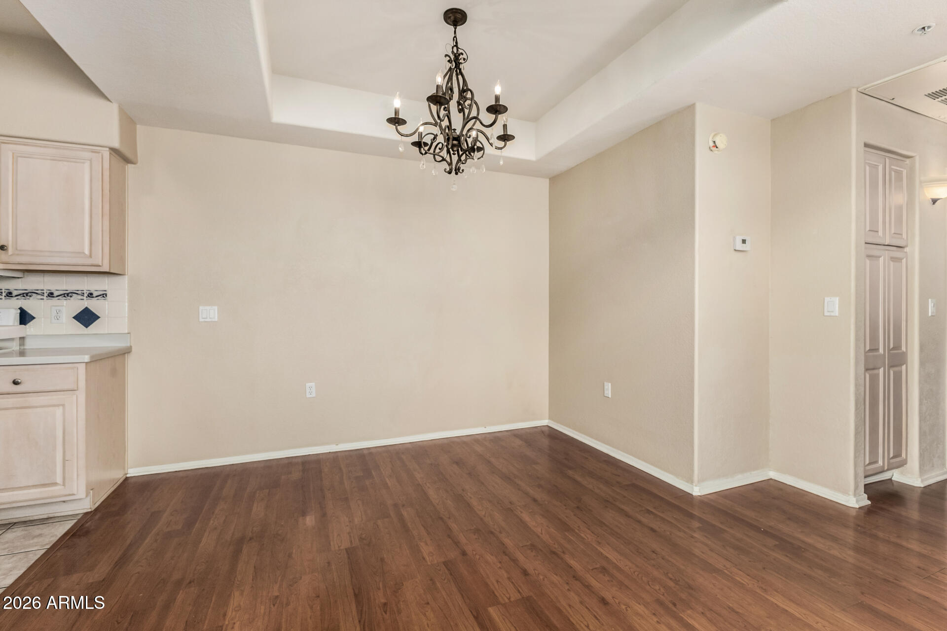 1445 East Broadway Road, Unit 116 Tempe, AZ 85282 - Photo 10 of 36 a view of a kitchen with wooden floor and a window