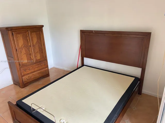 a view of a livingroom with furniture and hardwood floor