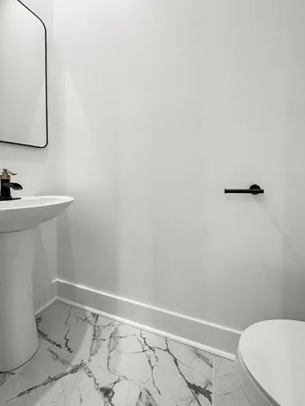 a bathroom with a sink and a toilet