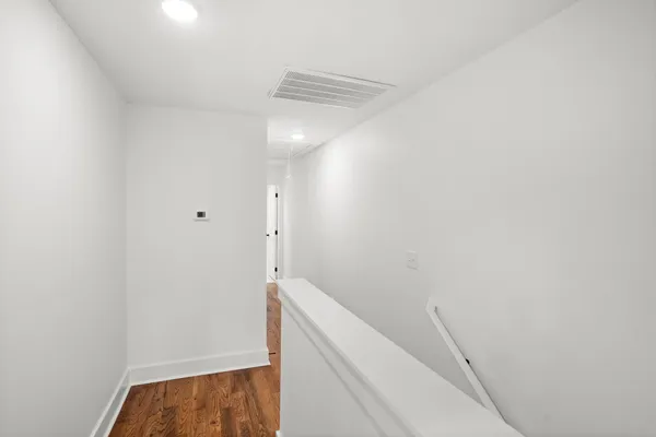 a view of storage and utility room with closet