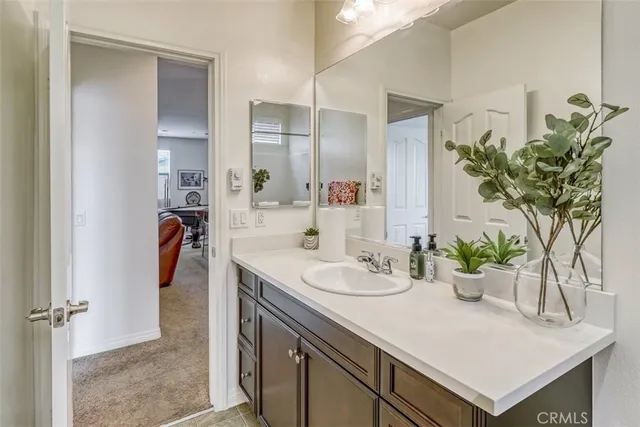 a bathroom with a sink and mirror