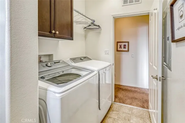 a kitchen with a stove and a refrigerator