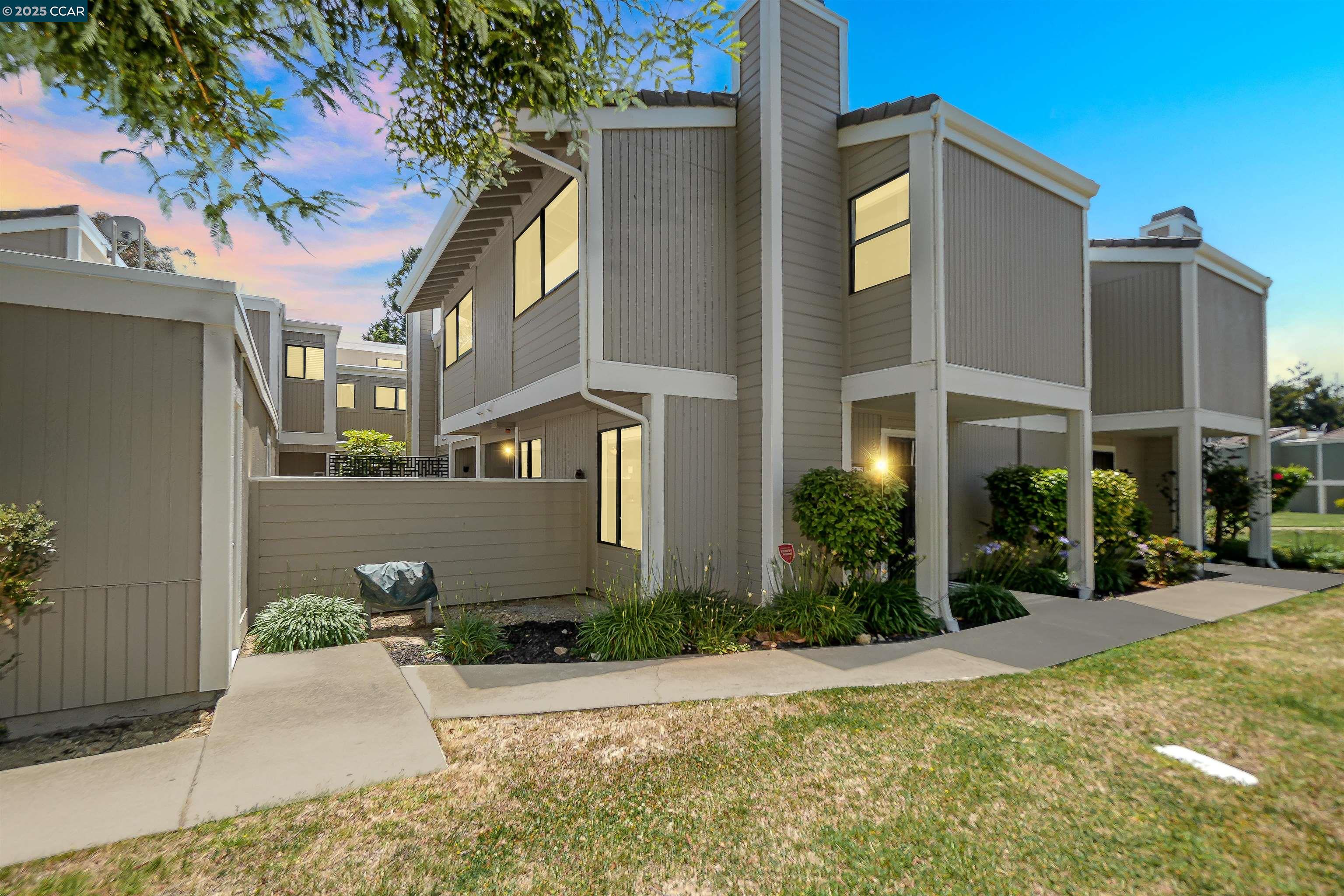 front view of a house with a yard