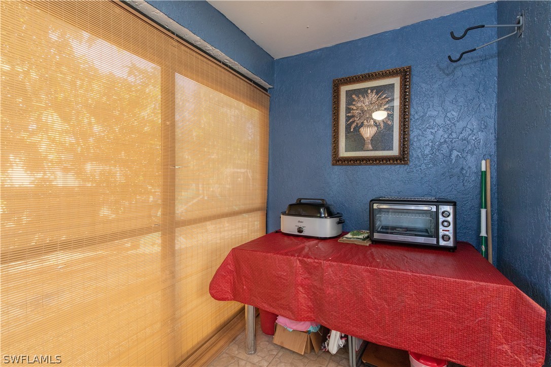 7467-69 Field Road, Unit 69 Fort Myers, FL 33967 - Photo 20 of 35 a bedroom with bed and a window