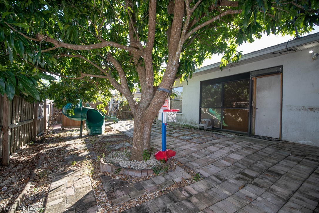 7467-69 Field Road, Unit 69 Fort Myers, FL 33967 - Photo 21 of 35 a backyard of a house with entertaining space