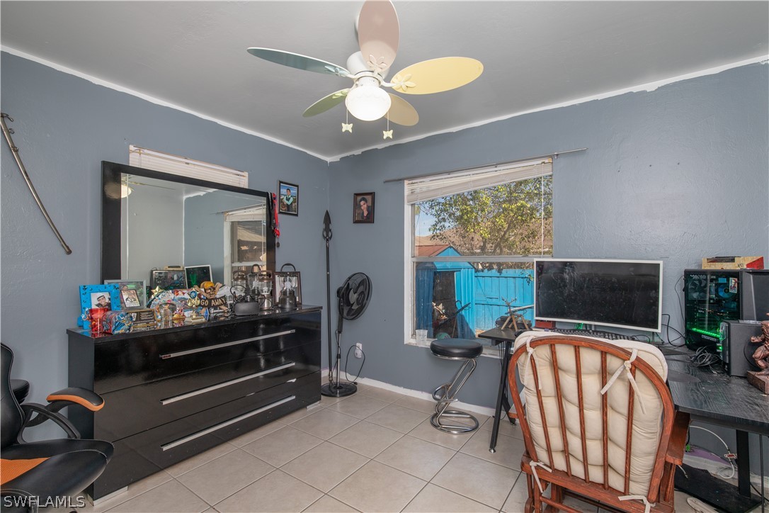 7467-69 Field Road, Unit 69 Fort Myers, FL 33967 - Photo 26 of 35 a bedroom with furniture and a window