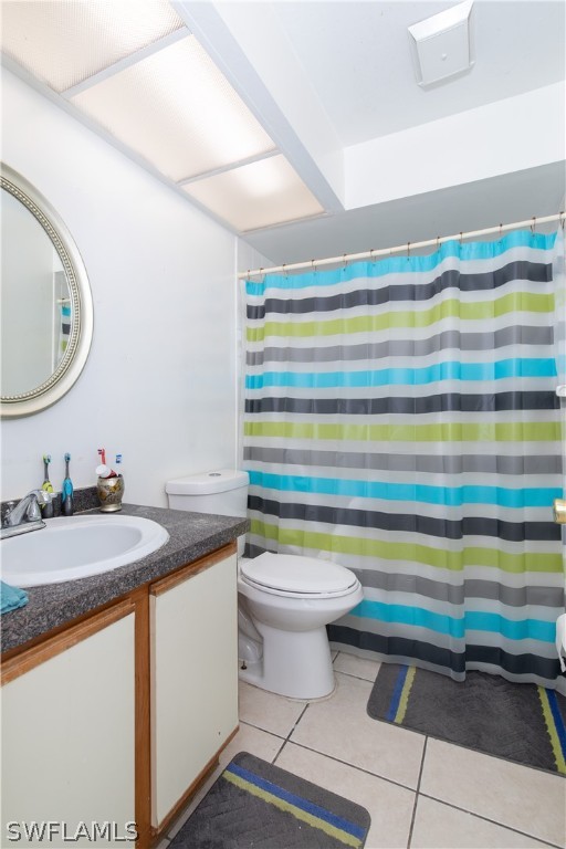 7467-69 Field Road, Unit 69 Fort Myers, FL 33967 - Photo 27 of 35 a bathroom with a sink a toilet and a mirror