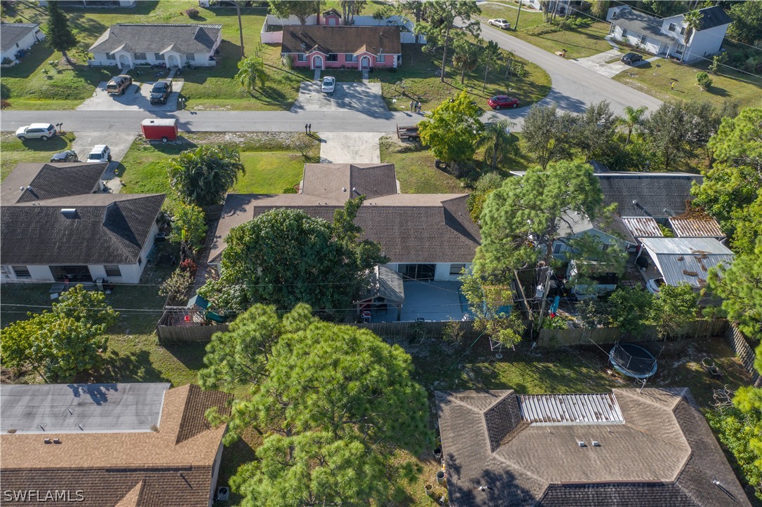 7467-69 Field Road, Unit 69 Fort Myers, FL 33967 - Photo 5 of 35 an aerial view of a house with a garden and swimming pool