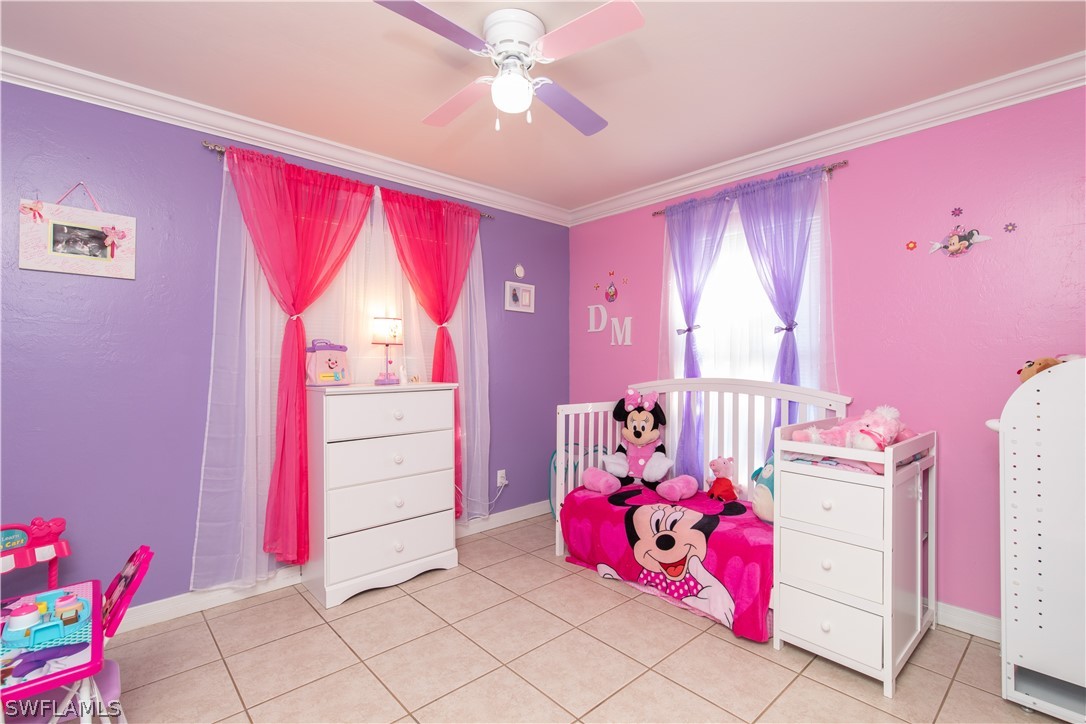 7467-69 Field Road, Unit 69 Fort Myers, FL 33967 - Photo 10 of 35 a bedroom with furniture and a window