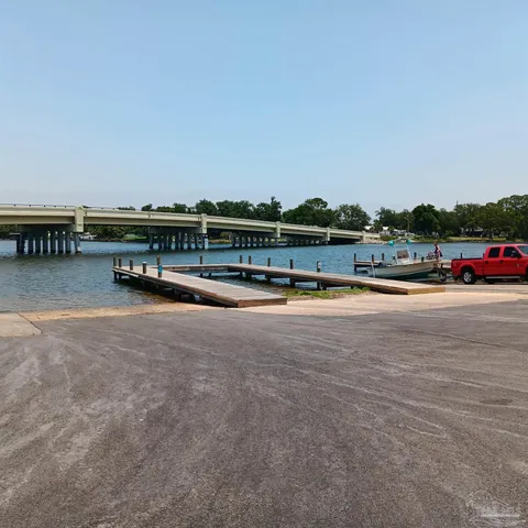 a view of swimming pool with outdoor seating and city view