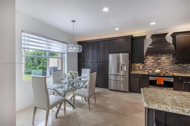 a kitchen with stainless steel appliances granite countertop wooden cabinets a sink and dishwasher