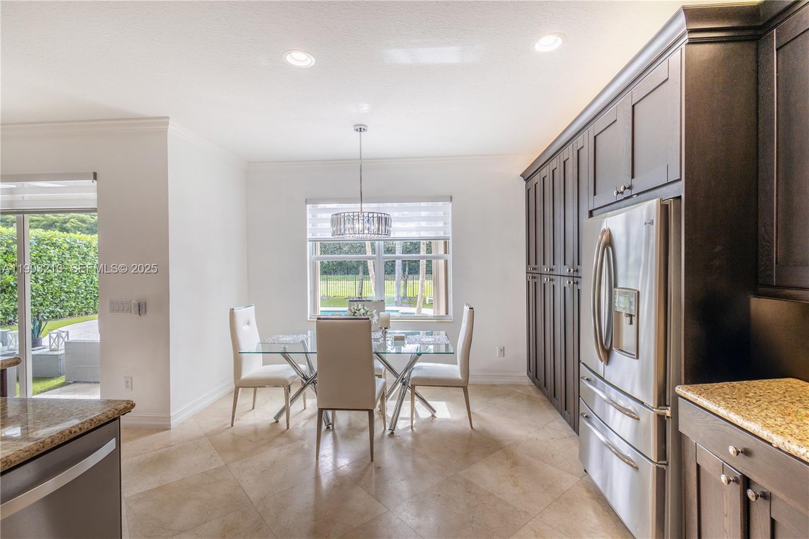 8292 Triana Point Avenue Boynton Beach, FL 33473 - Photo 25 of 60 a view of a dining room with furniture window and outside view