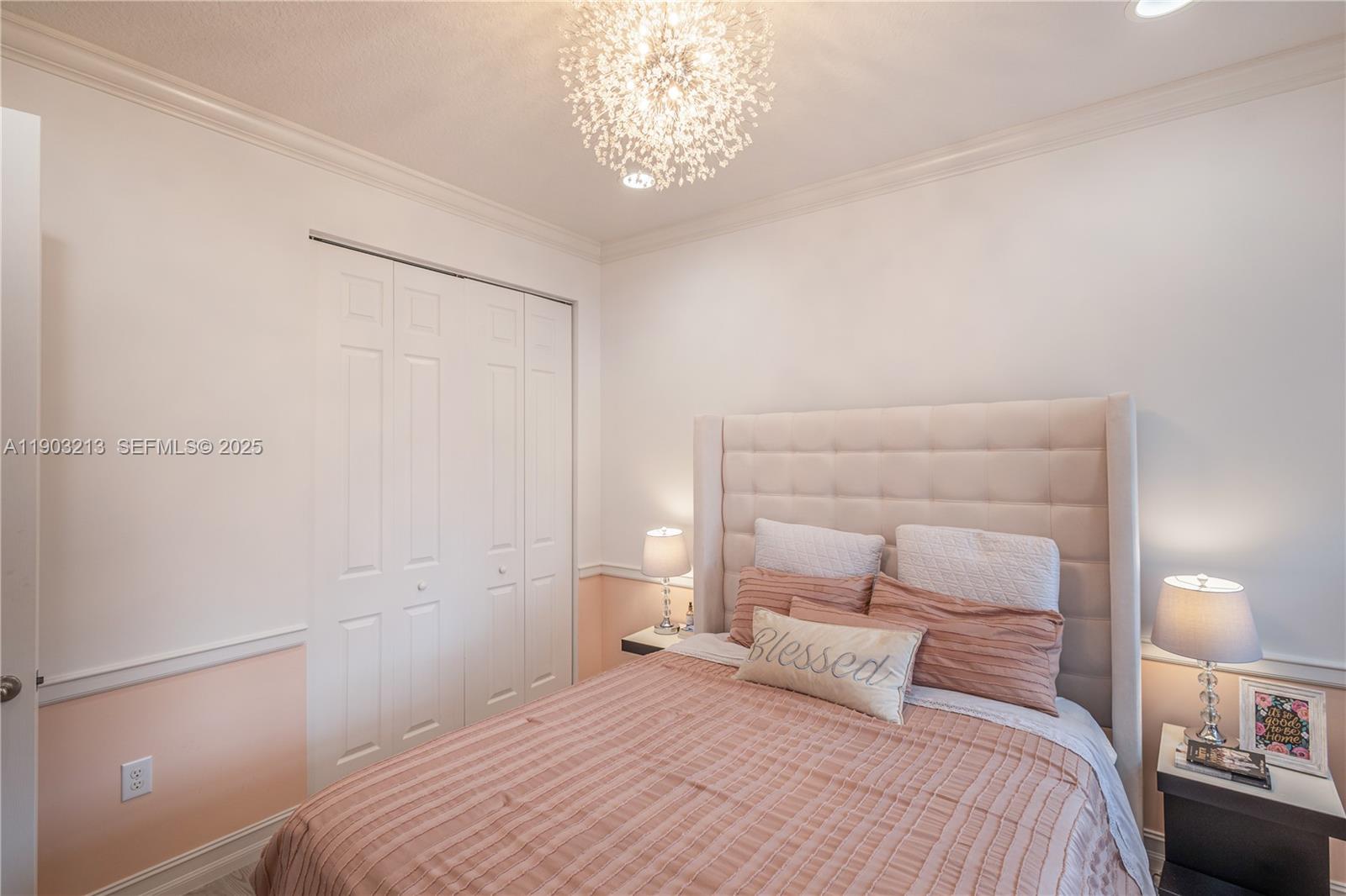 8292 Triana Point Avenue Boynton Beach, FL 33473 - Photo 33 of 60 a bedroom with a bed and a night stand