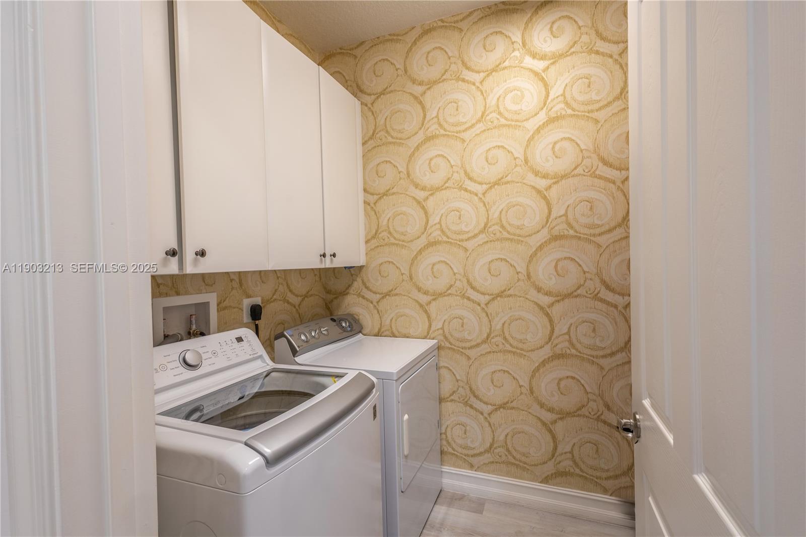 8292 Triana Point Avenue Boynton Beach, FL 33473 - Photo 35 of 60 a kitchen with a sink and a stove with white paint