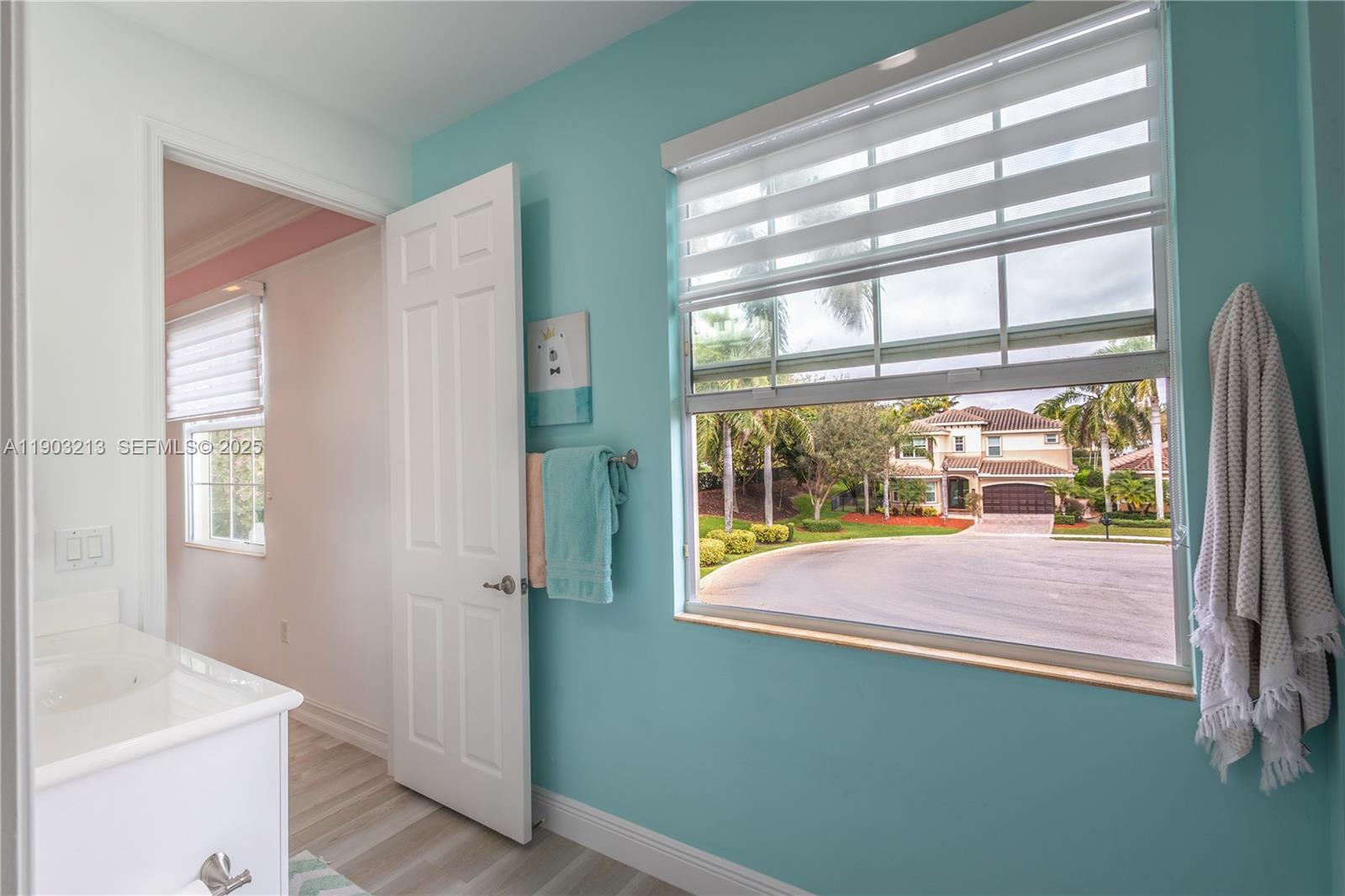 8292 Triana Point Avenue Boynton Beach, FL 33473 - Photo 38 of 60 a view of a room that has a bed and a window