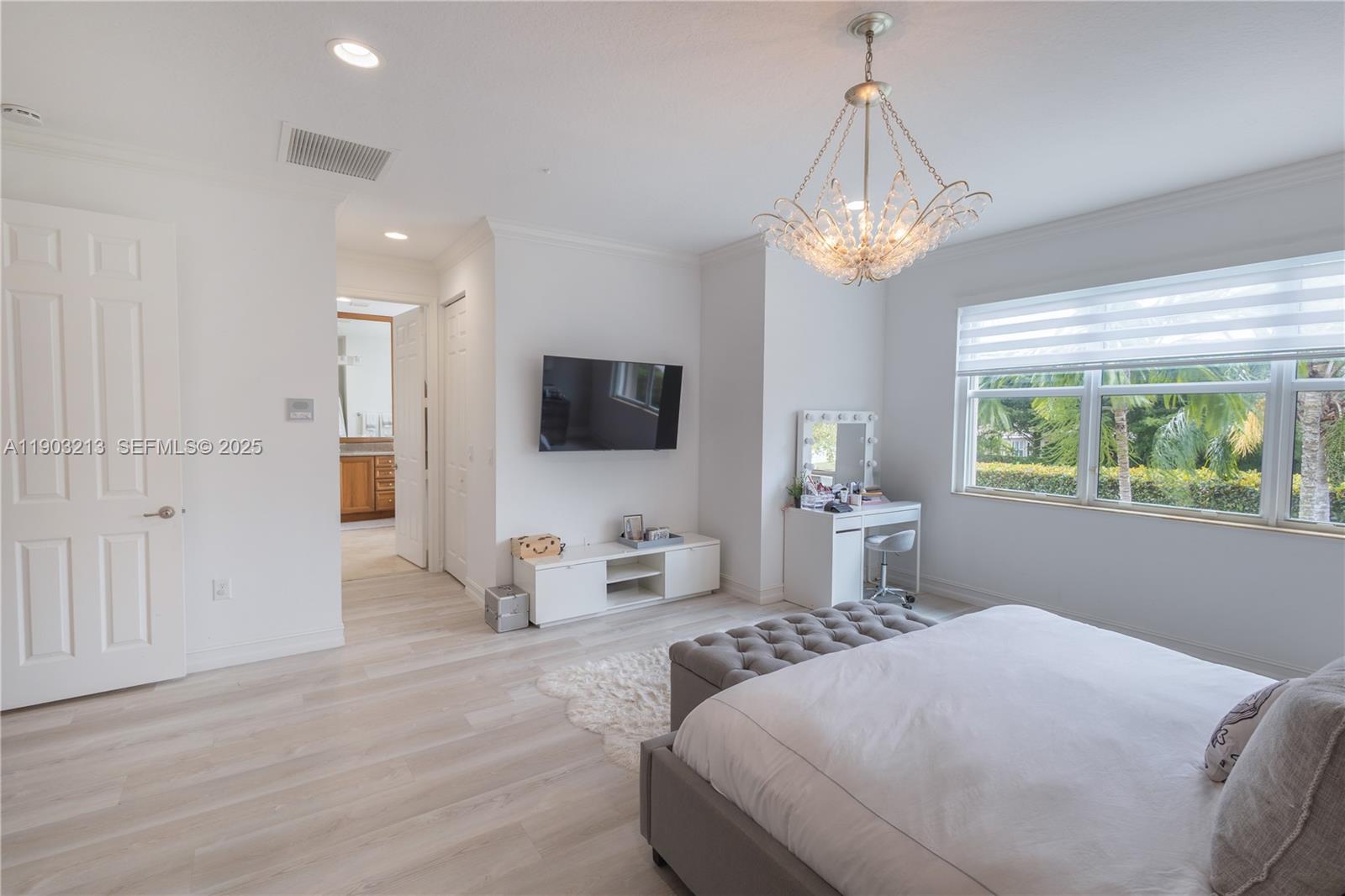 8292 Triana Point Avenue Boynton Beach, FL 33473 - Photo 45 of 60 a bedroom with bed tv and a window